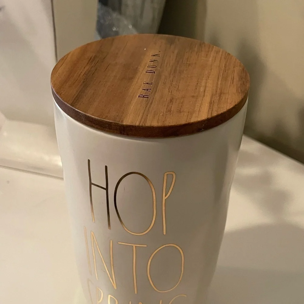 NWT, Rae Dunn, Ceramic Canister with wooden lid. “Hop Into Spring”
